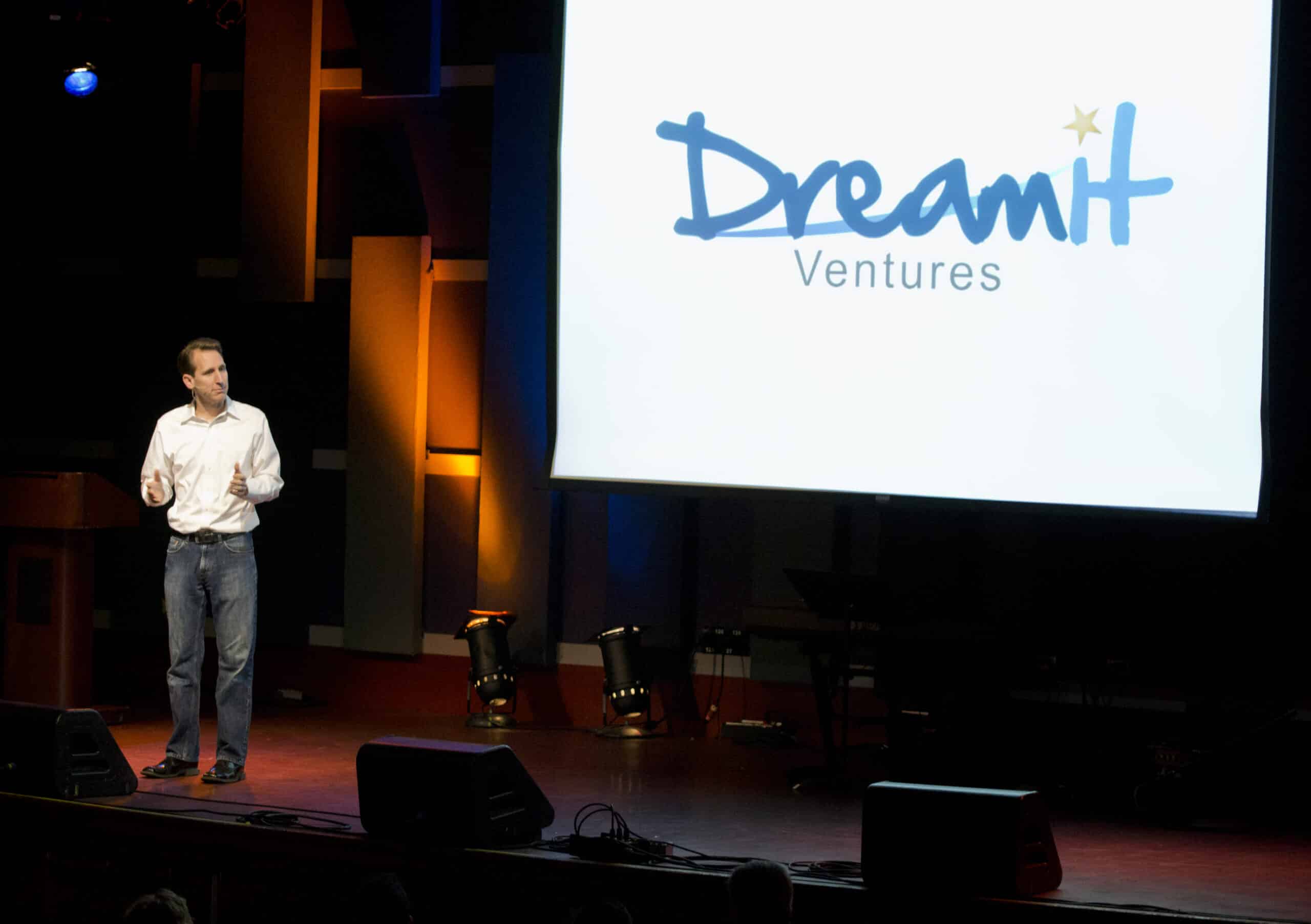 Steve on stage in front of a Dreamit Ventures screen