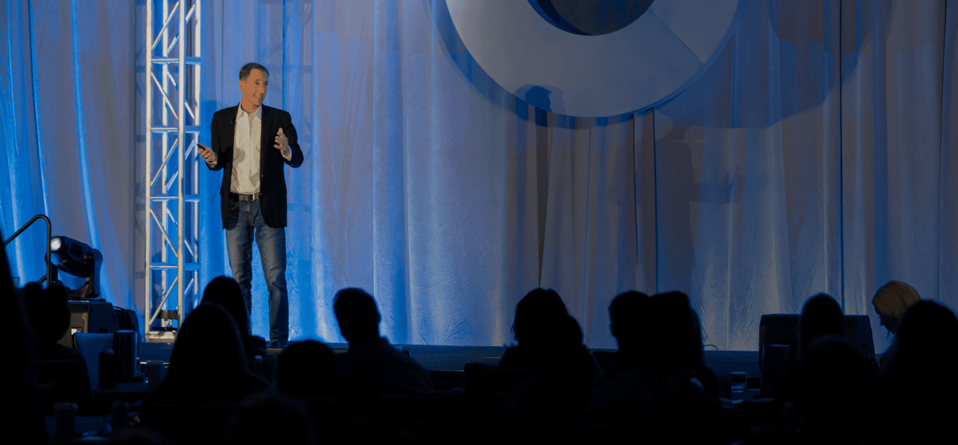 Steve Welch speaking on stage